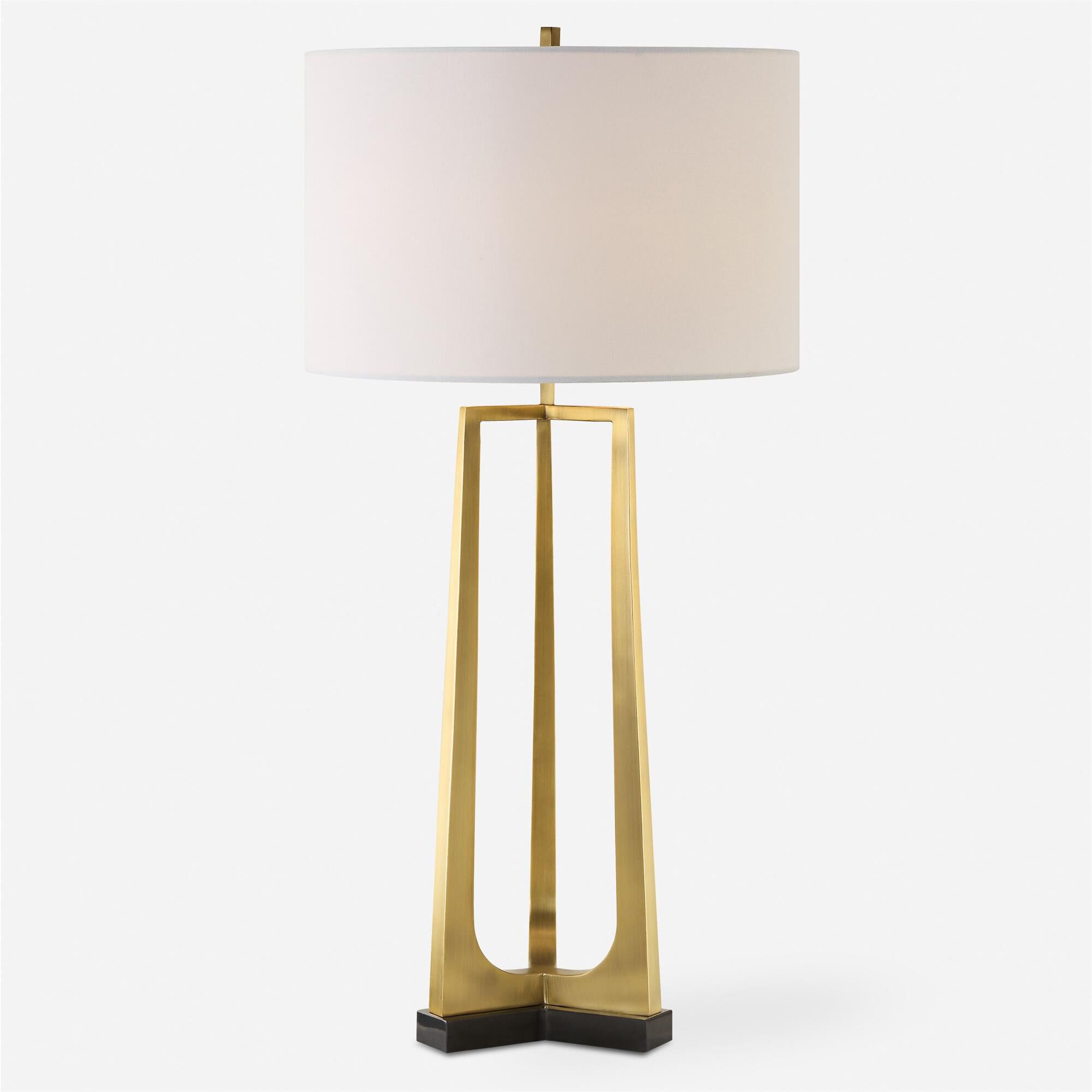 Shown in This Table Lamp Features A Sleek Iron Base With Three Tapered Legs Finished In Plated Antique Brass, finish and Round Drum Hardback shade