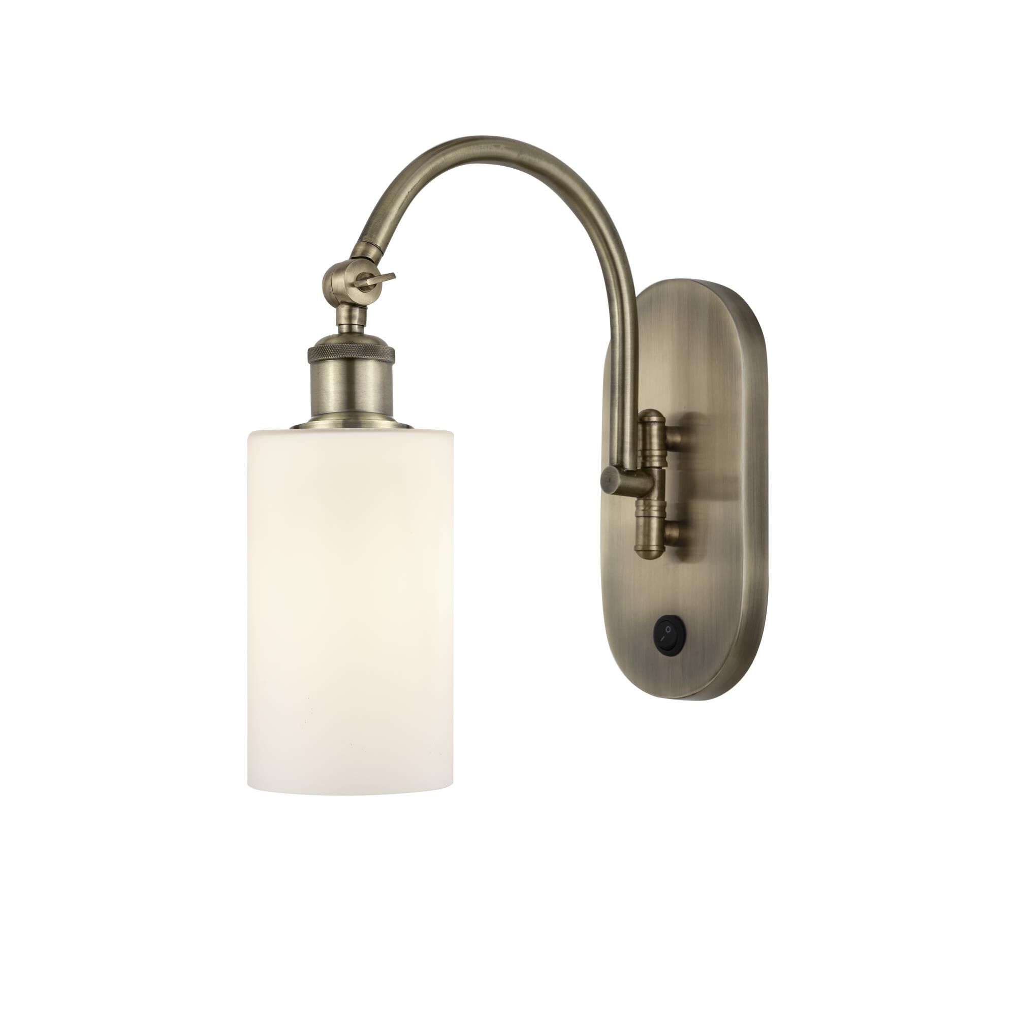 Shown in Antique Brass finish and Matte White glass