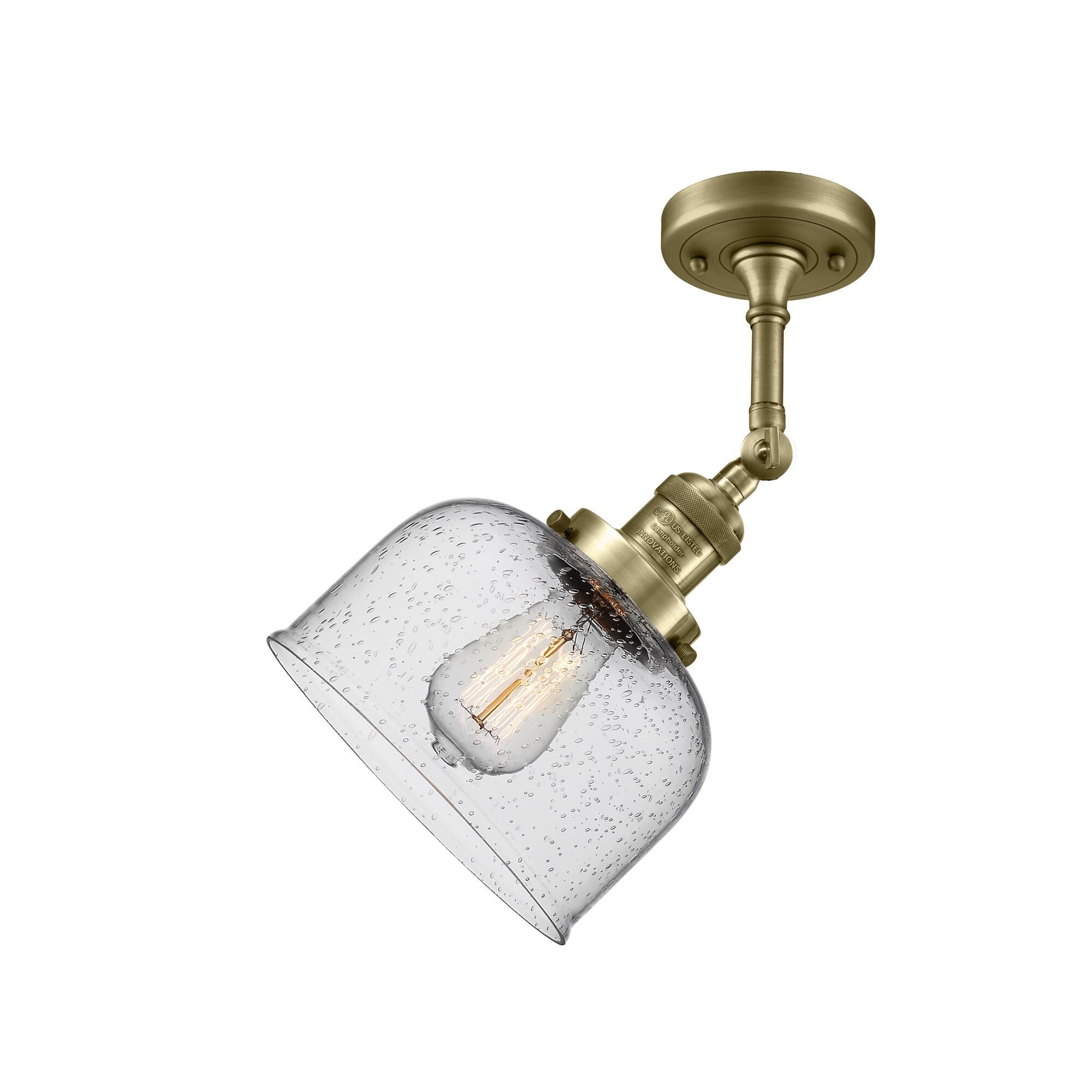Shown in Antique Brass finish and Seedy glass