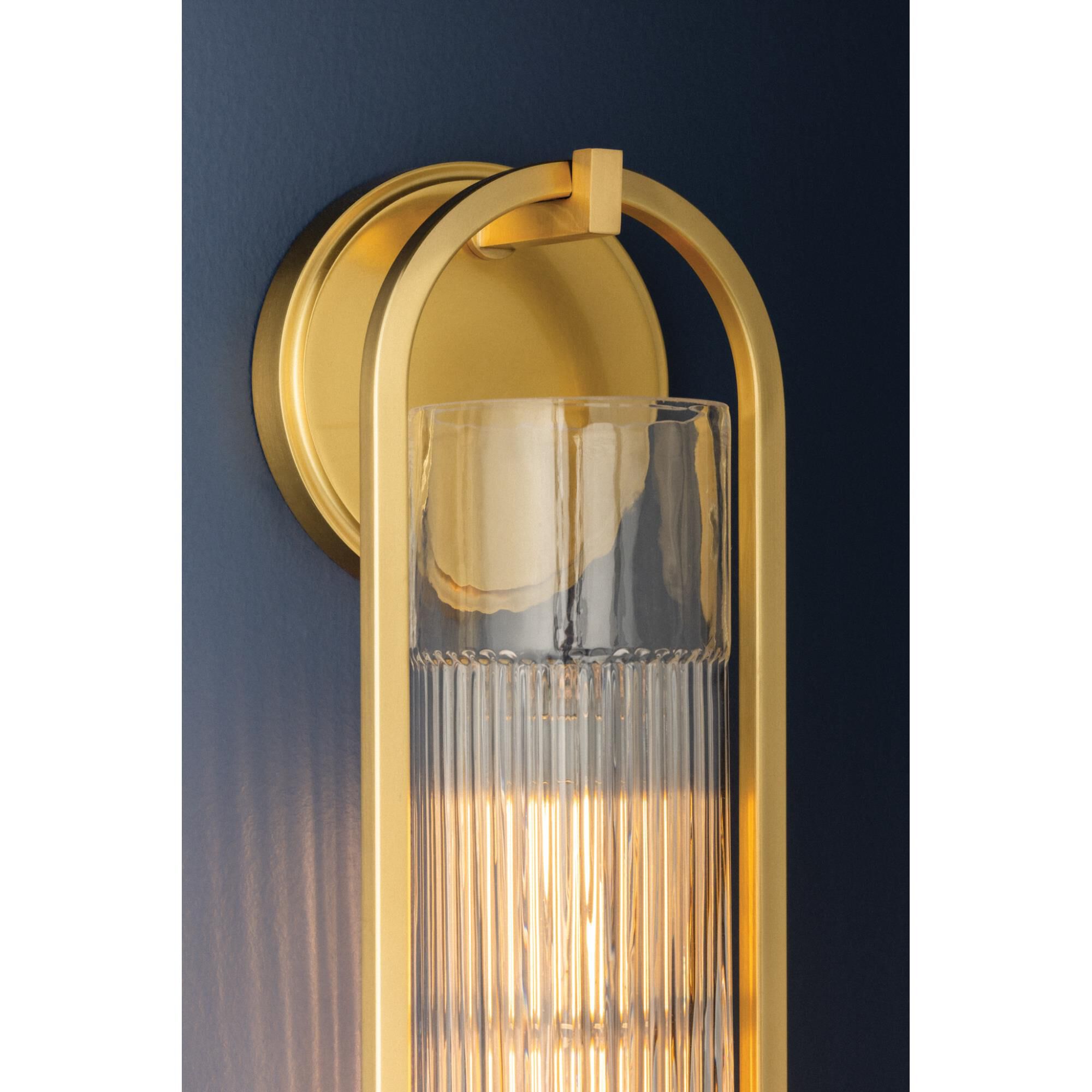 Shown in Aged Brass finish and Clear Optic glass