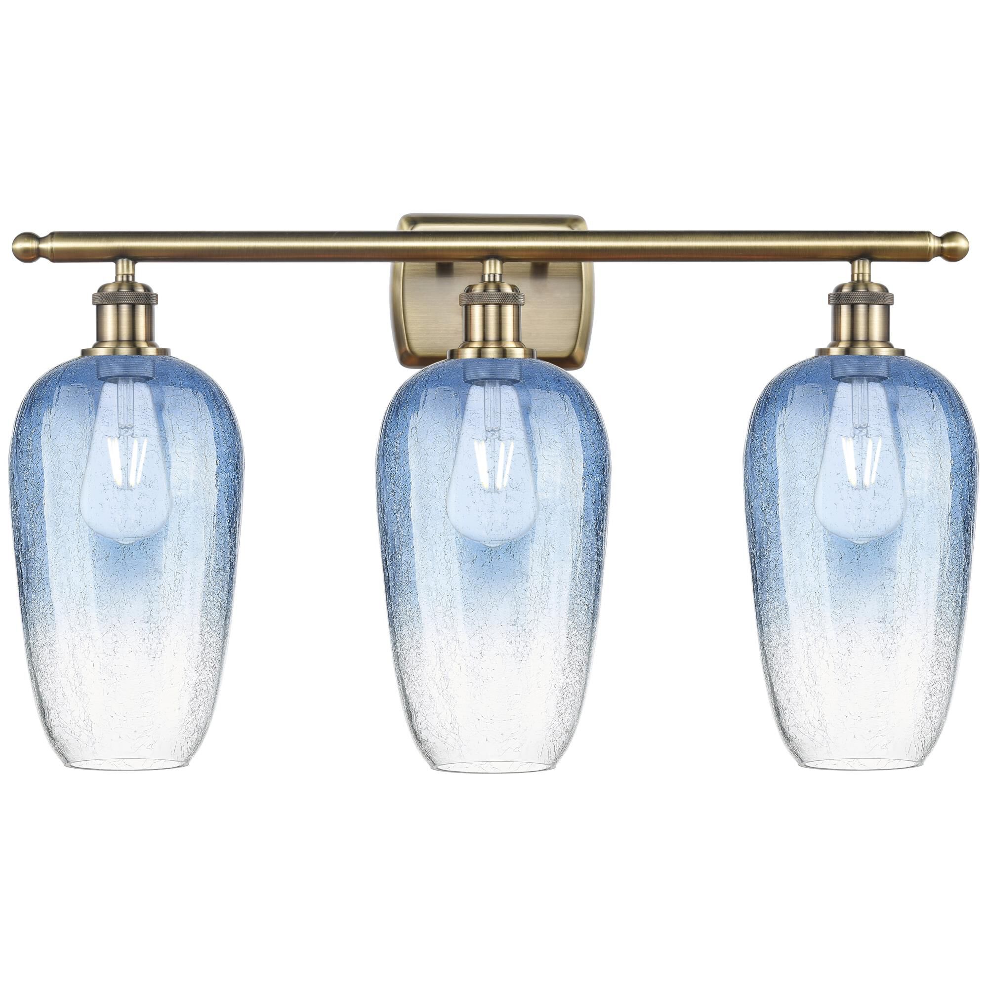 Shown in Antique Brass finish and Sapphire Blue glass