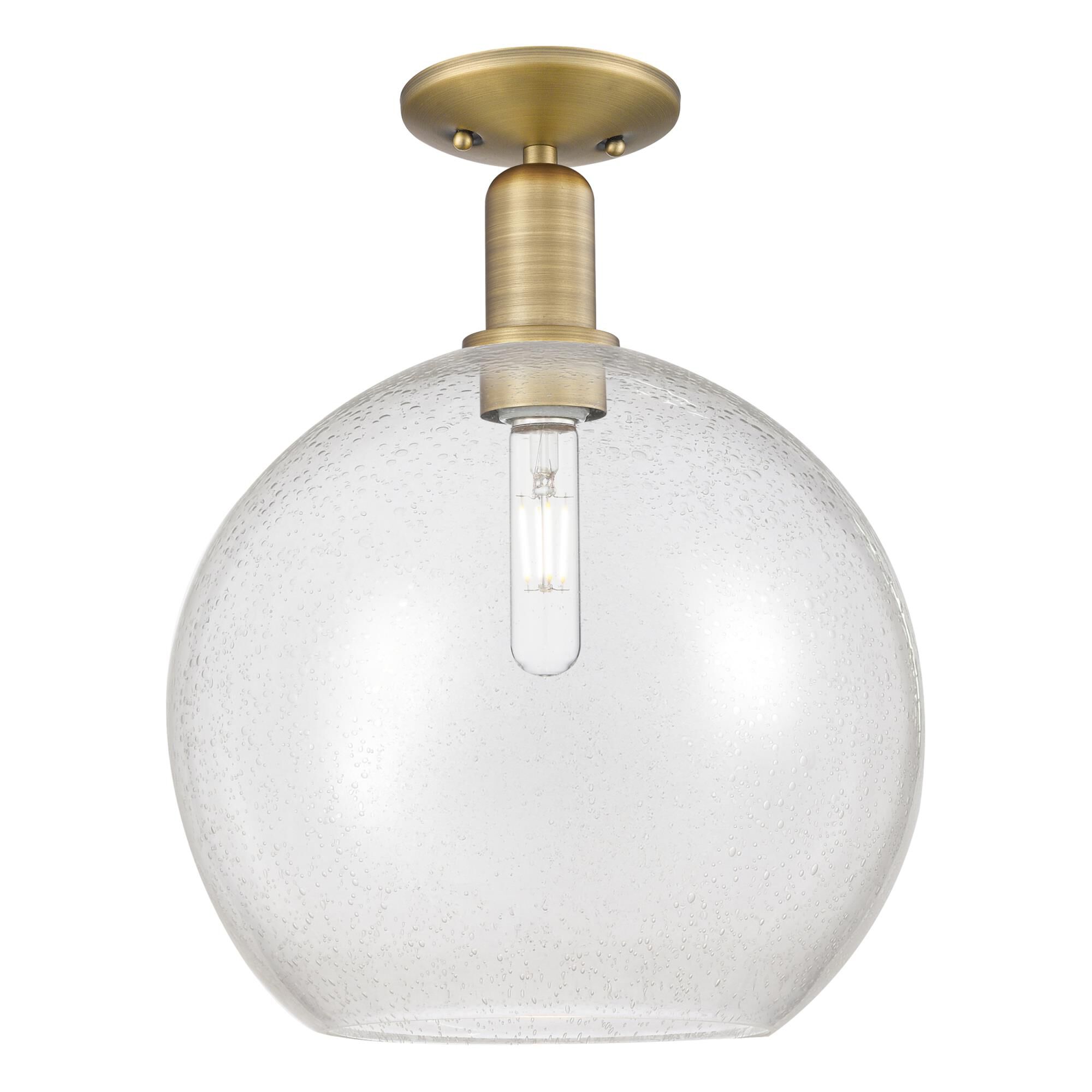 Shown in Brushed Brass finish and Seedy glass