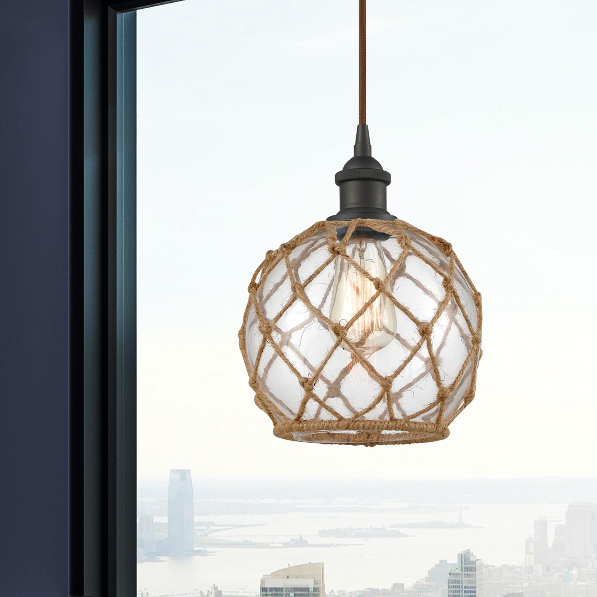 Shown in Oil Rubbed Bronze finish and Clear With Black Rope glass
