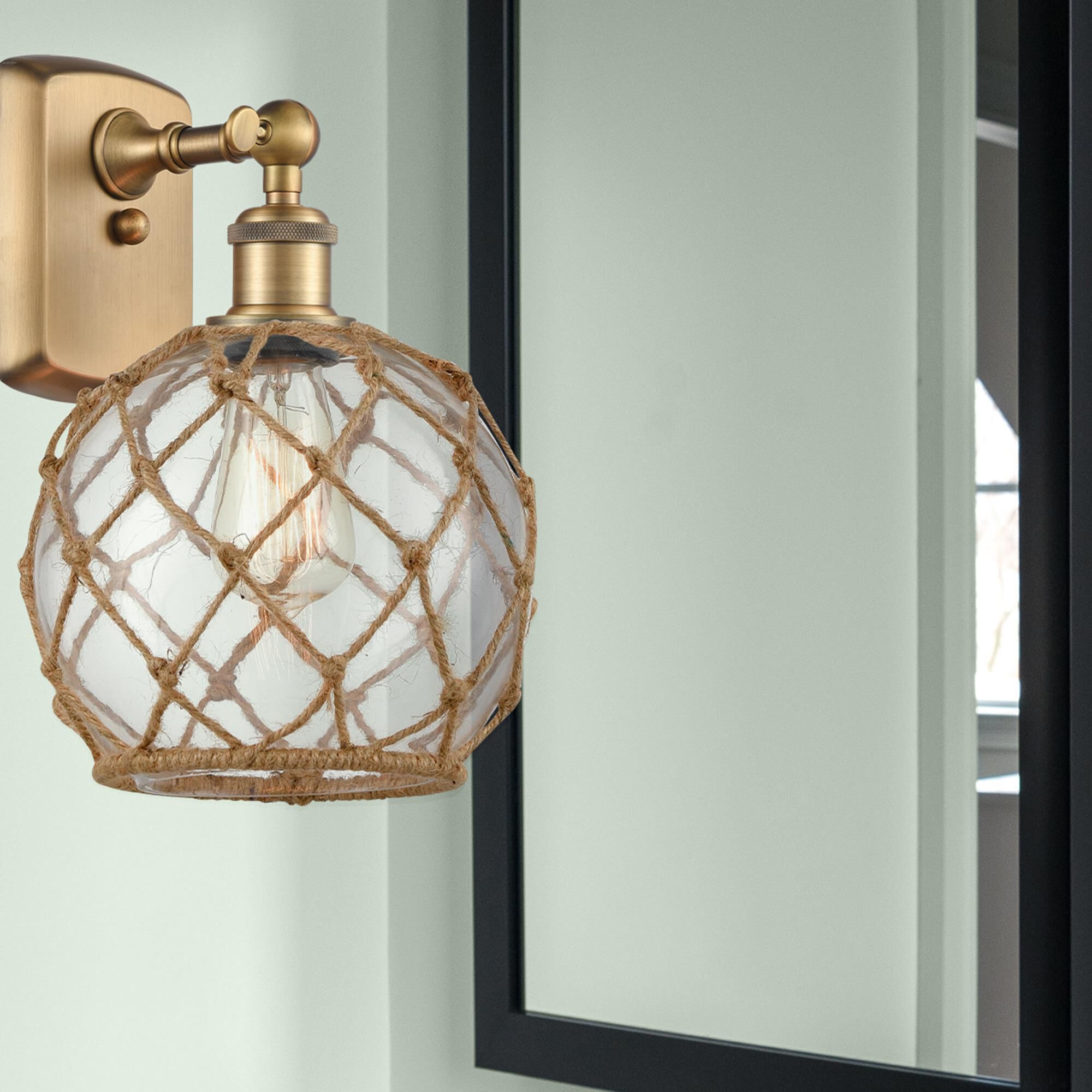 Shown in Brushed Brass finish and Sphere glass and Glass And Rope shade
