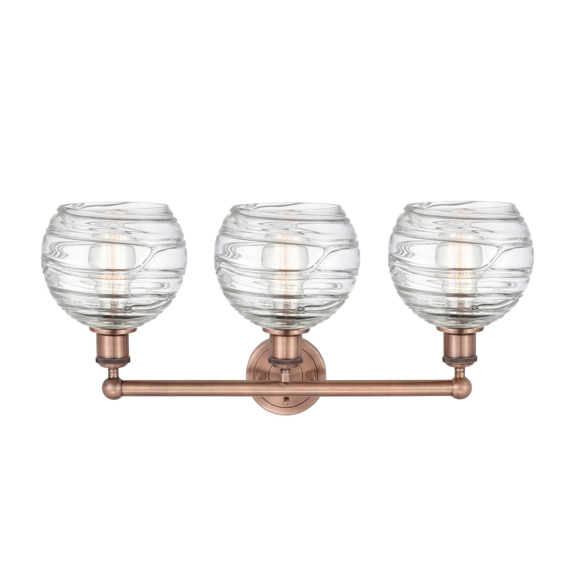 Shown in Antique Copper finish and Clear Deco Swirl glass