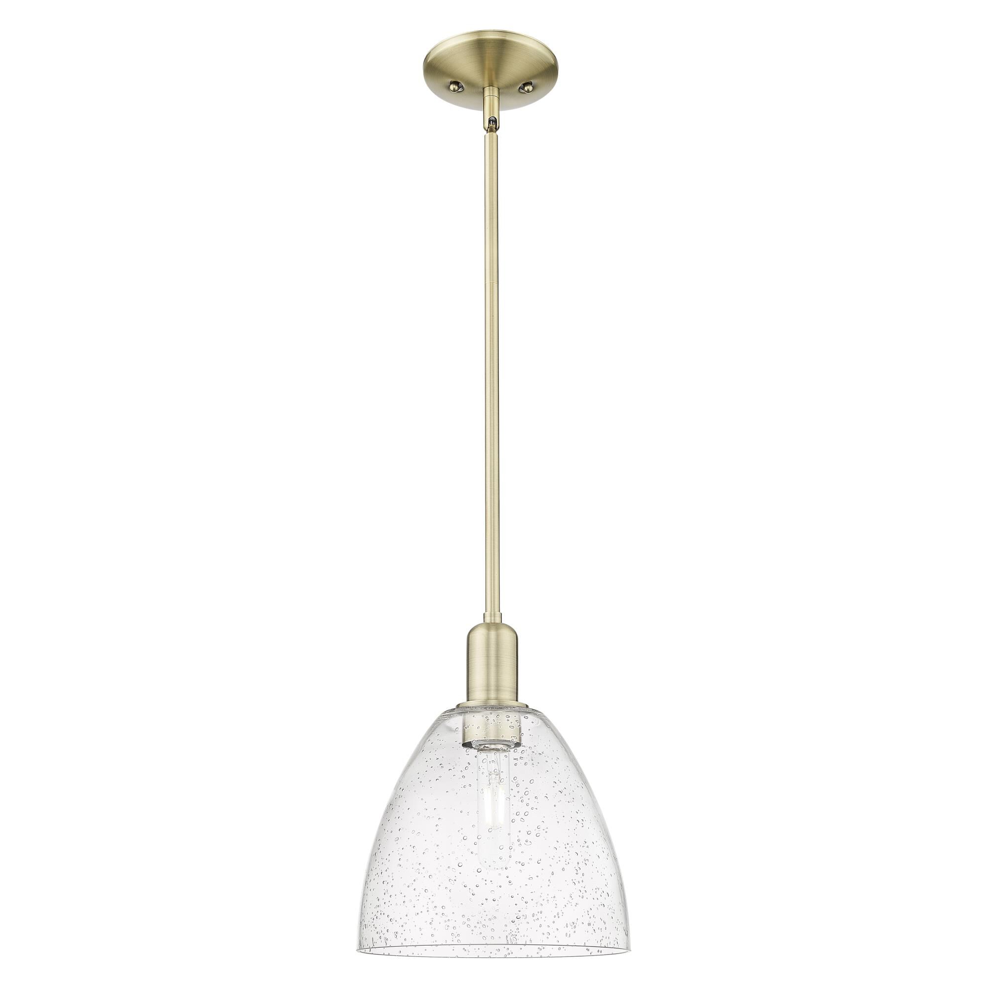 Shown in Antique Brass finish and Seedy glass