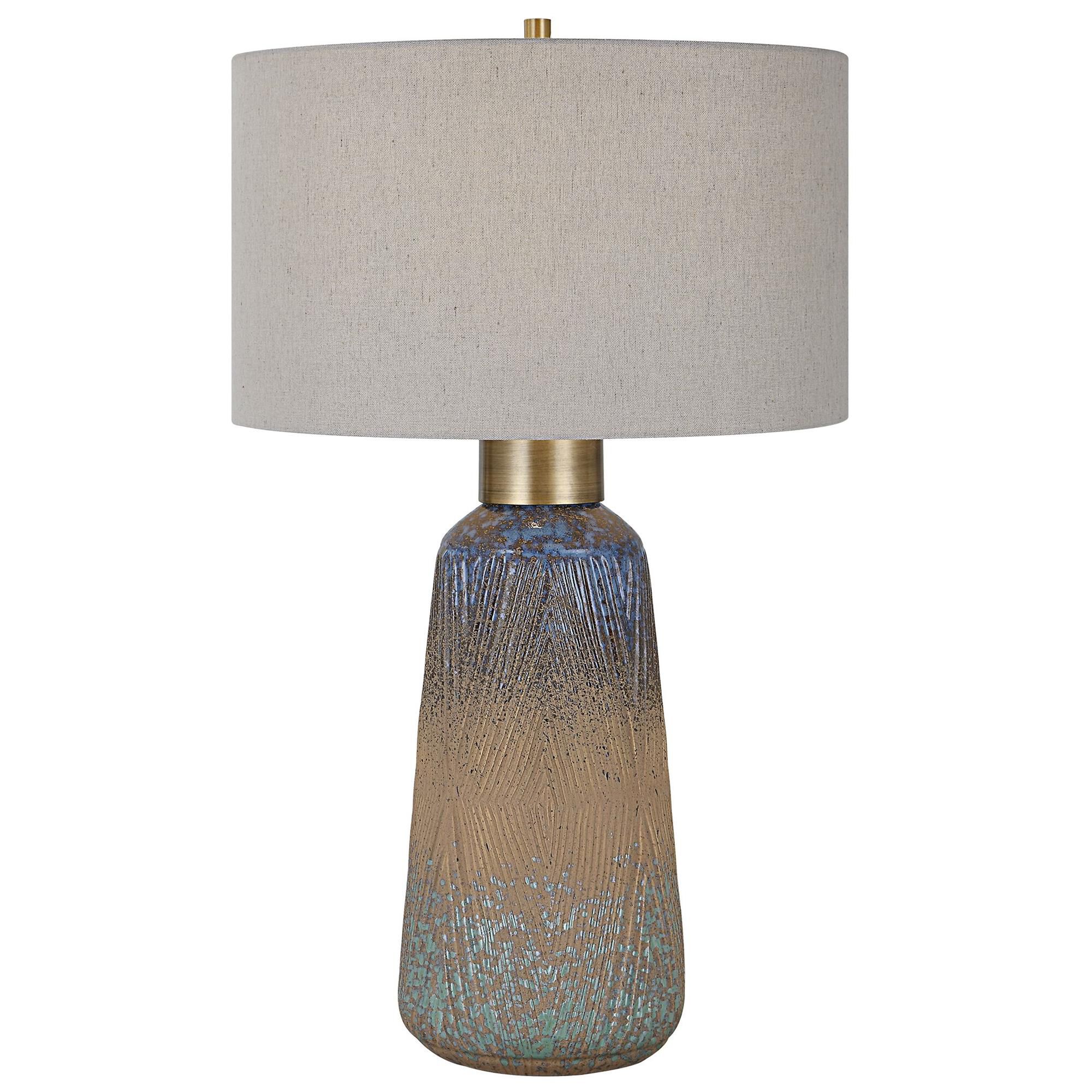 Shown in A Beautiful Display Of Color And Style, This Ceramic Table Lamp Features An Embossed Design With A U finish and Round Hardback Drum shade