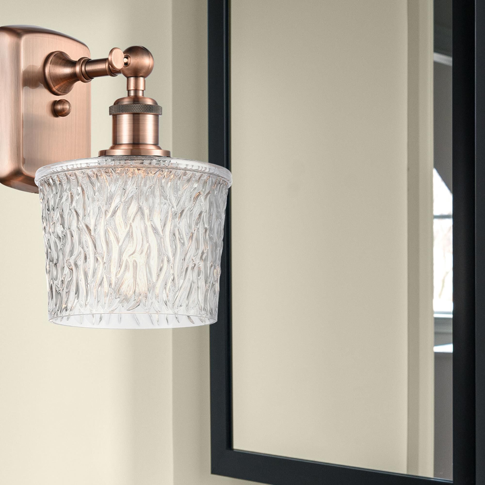 Shown in Antique Copper finish and Clear Niagra glass and Polished Chrome accent