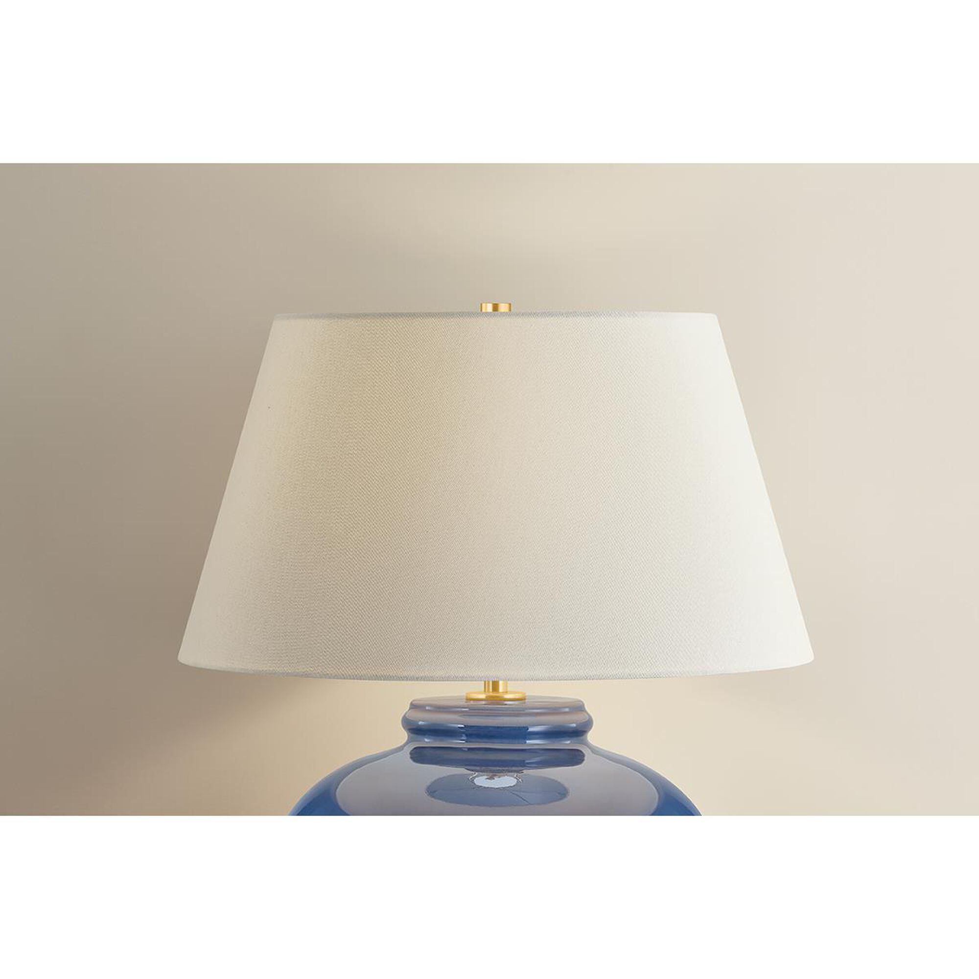 Shown in Aged Brass and Ceramic Parrish Blue finish and Off White Linen shade