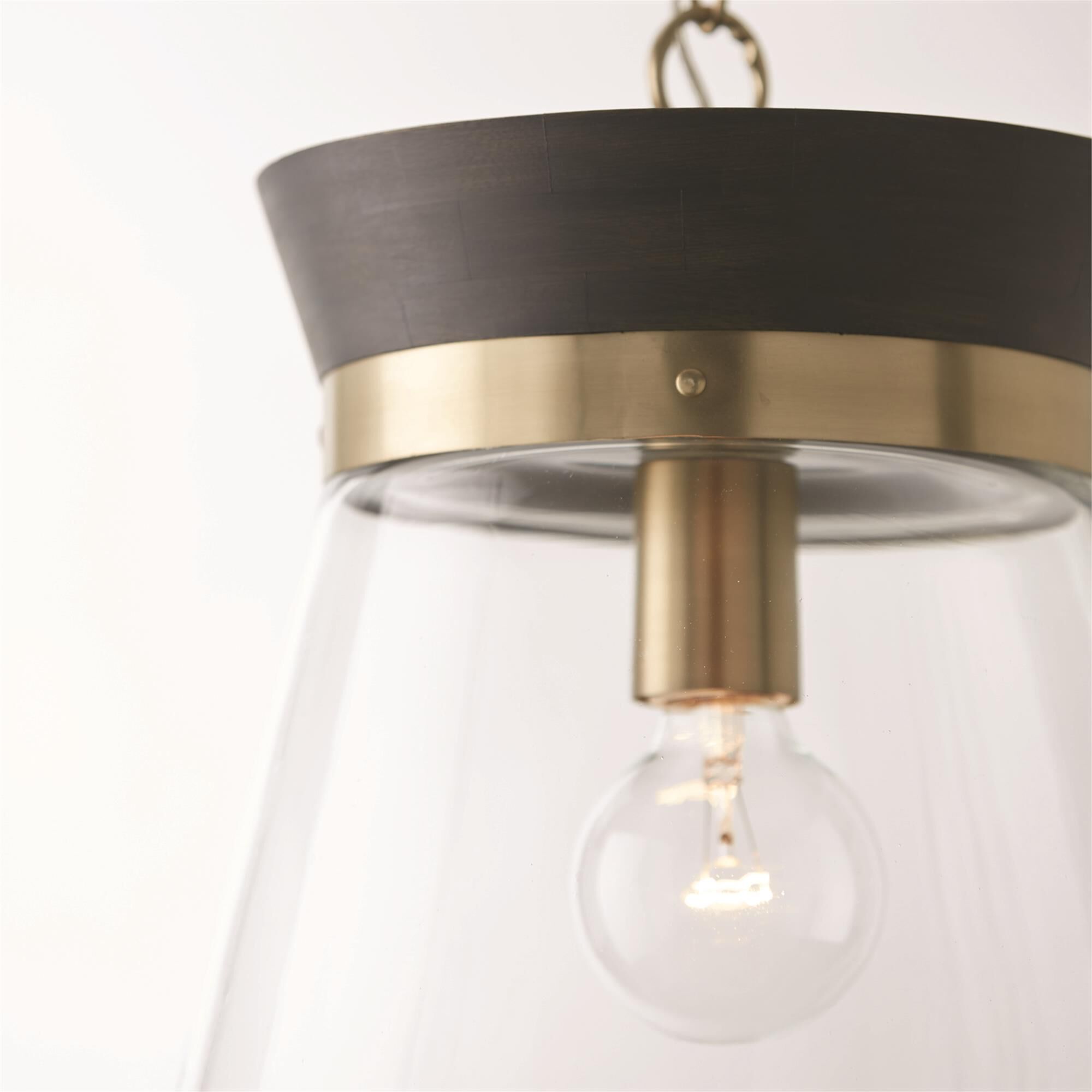 Shown in Black Stain and Matte Brass finish and Clear glass