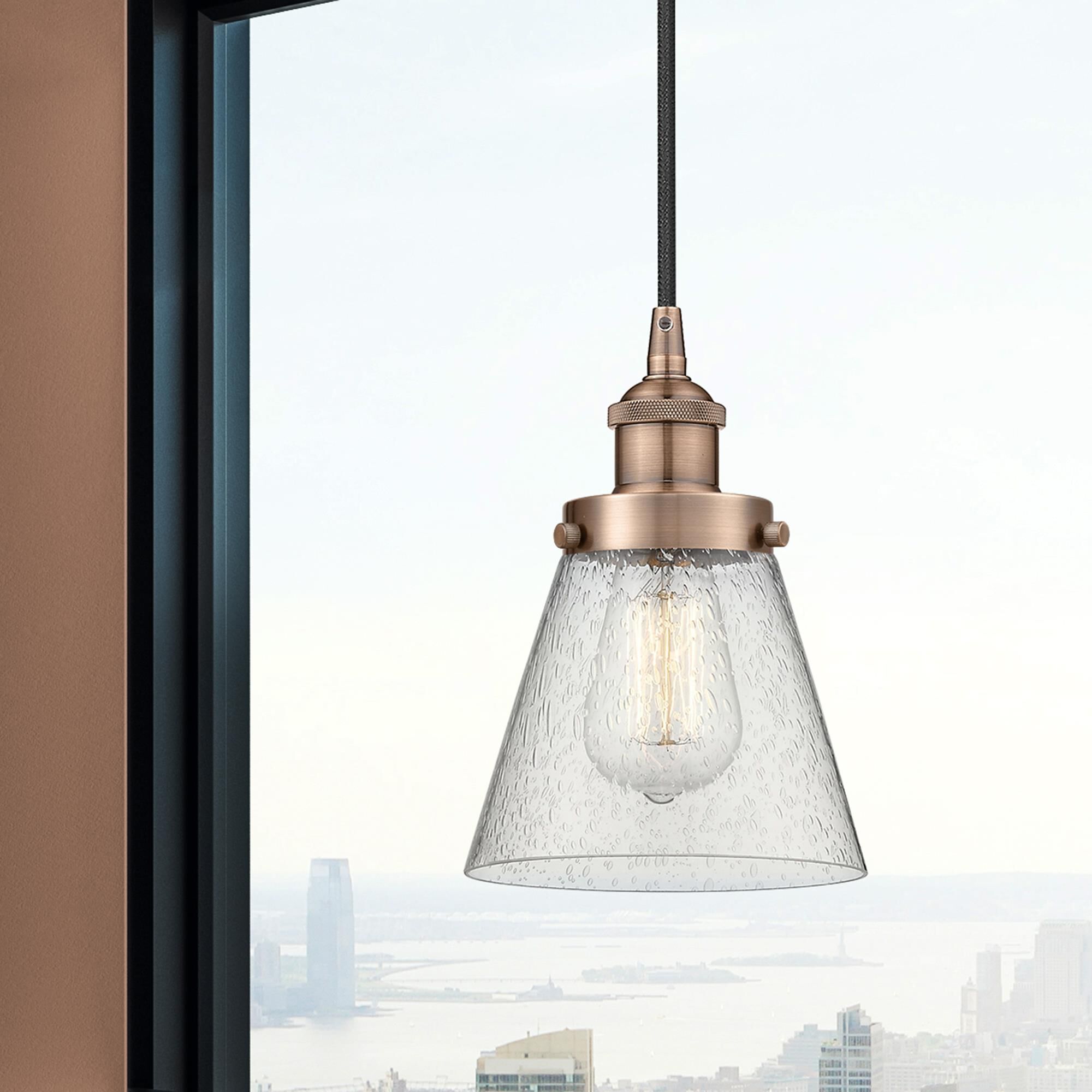 Shown in Antique Copper finish and Seedy Small Cone glass