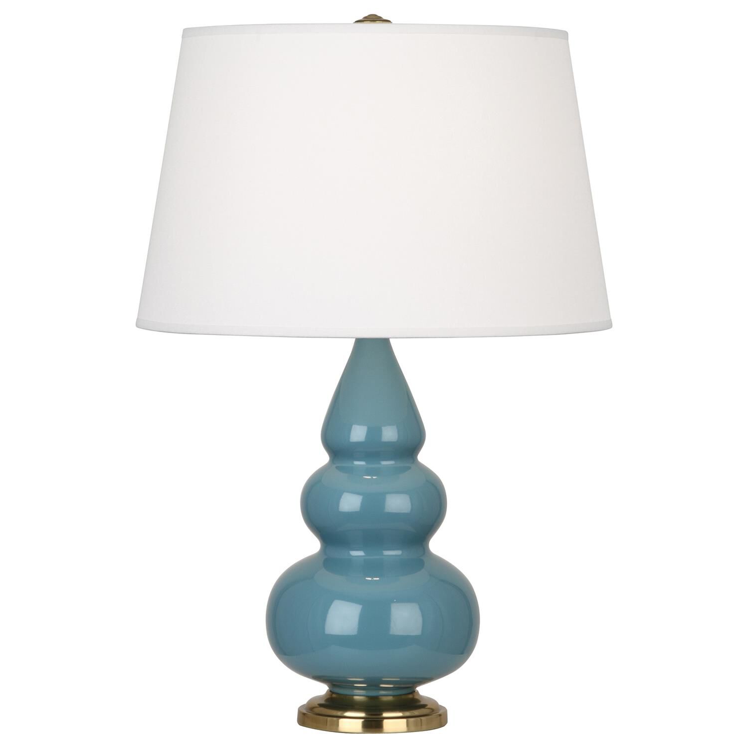 Shown in Steel Blue Glazed Ceramic With Antique Brass ed Accents finish and Pearl Dupioni Fabric shade