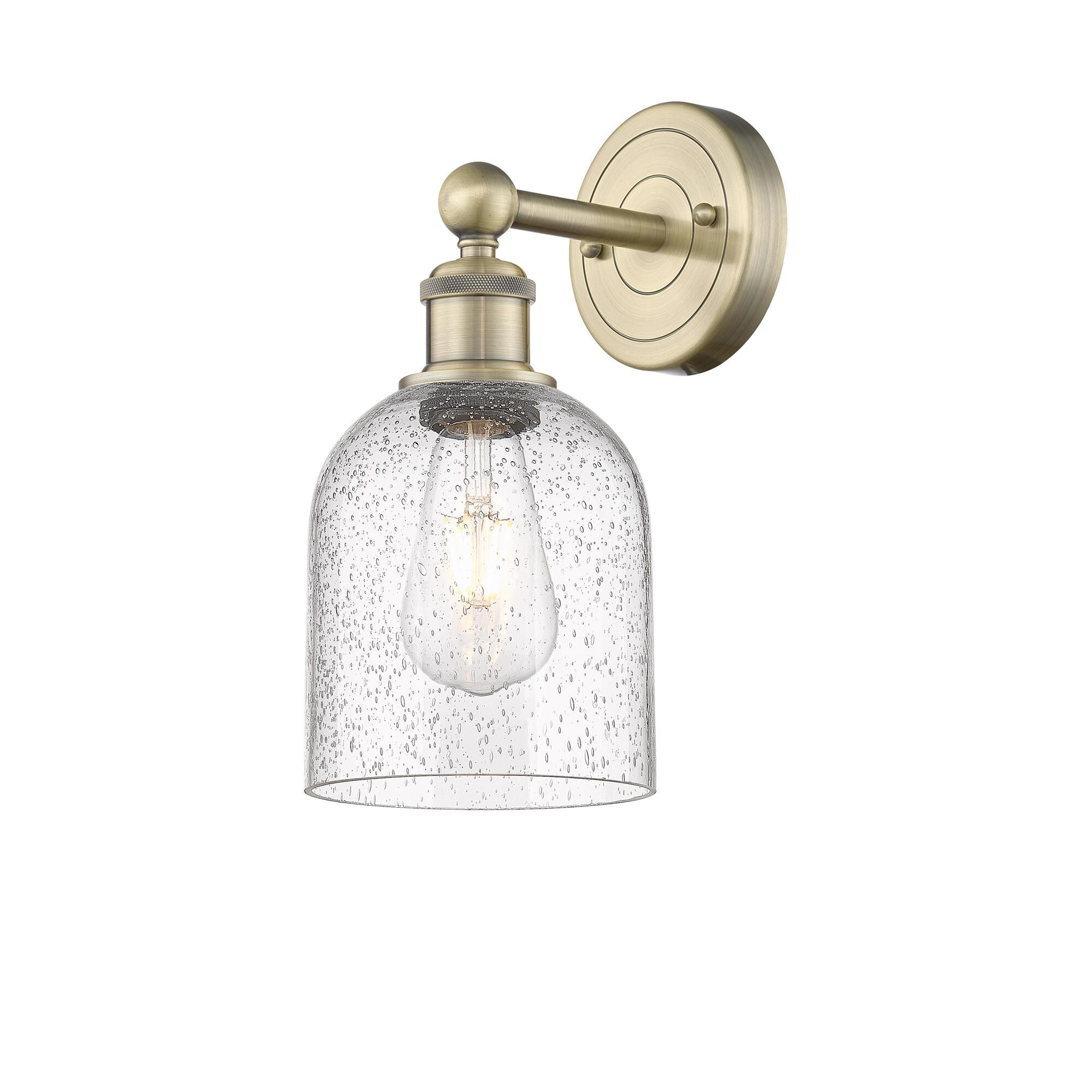 Shown in Antique Brass finish and Seedy glass