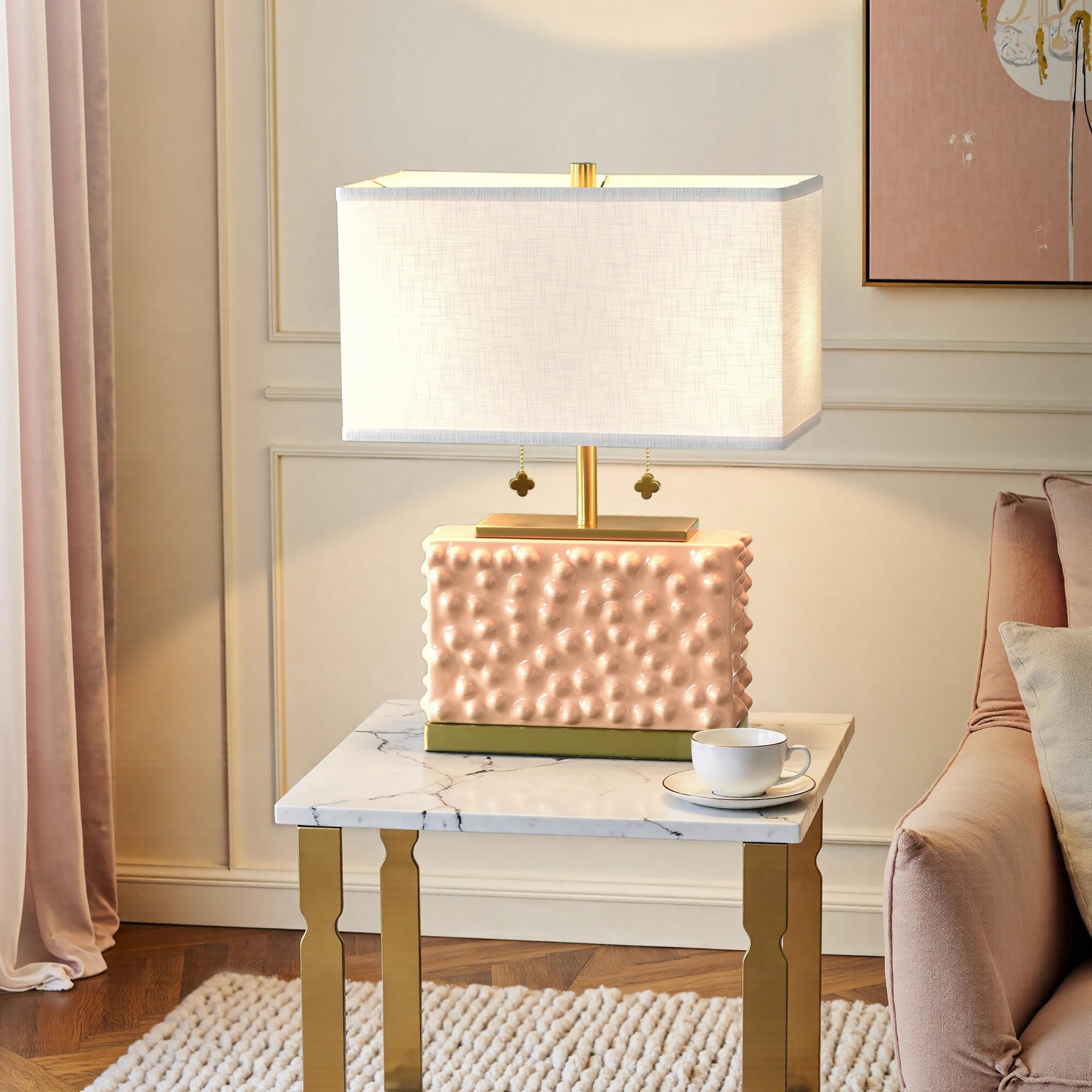 Shown in Pearl Blush and Polished Brass finish and Off-White shade
