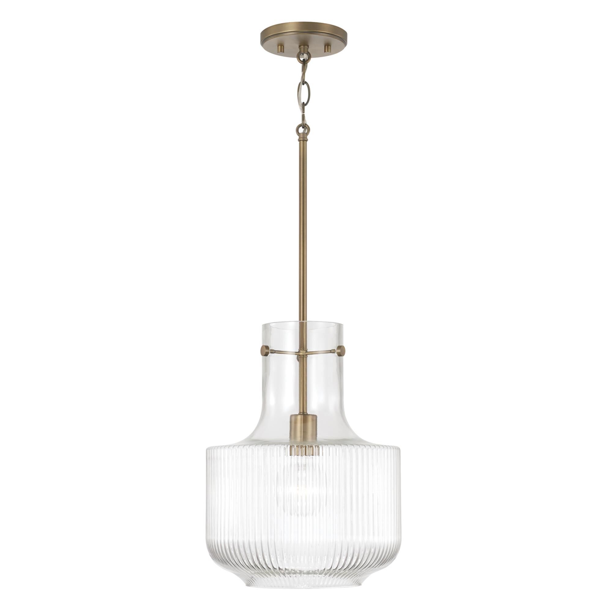 Shown in Aged Brass finish and Clear Fluted glass