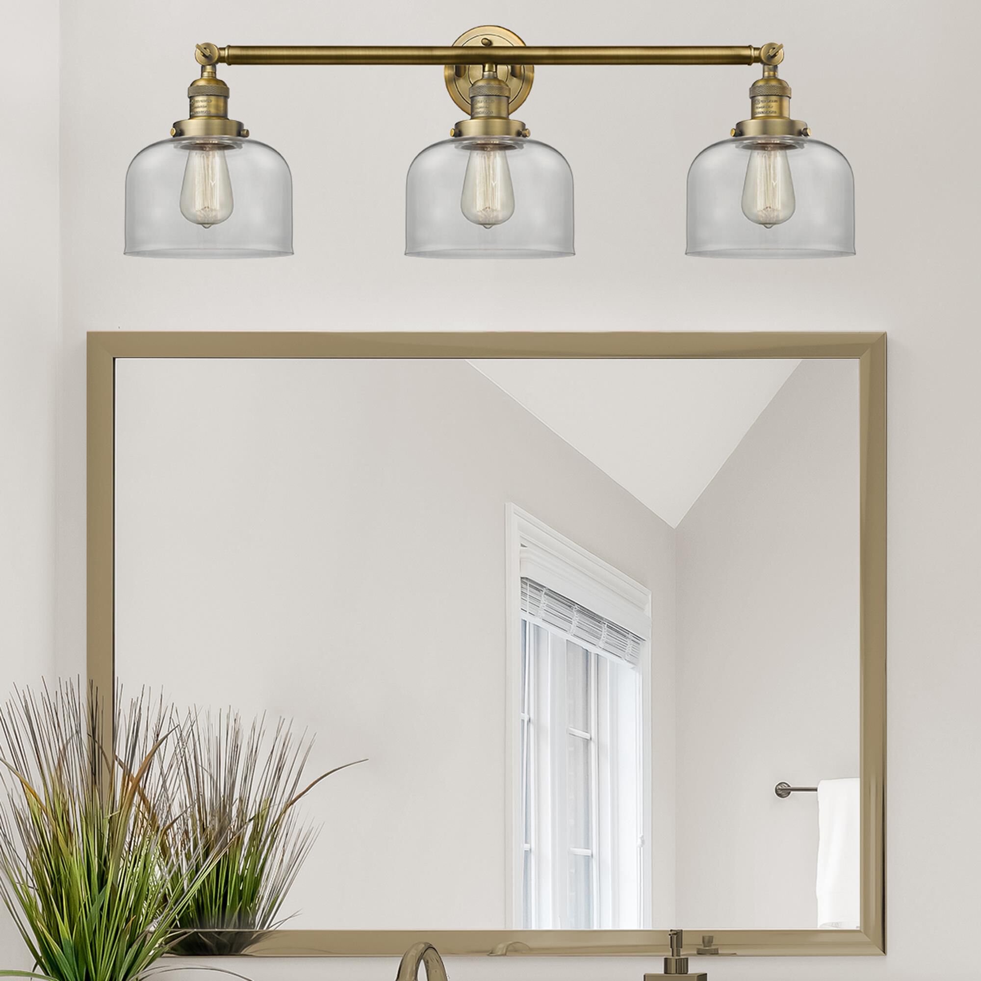 Shown in Brushed Brass finish and Clear glass
