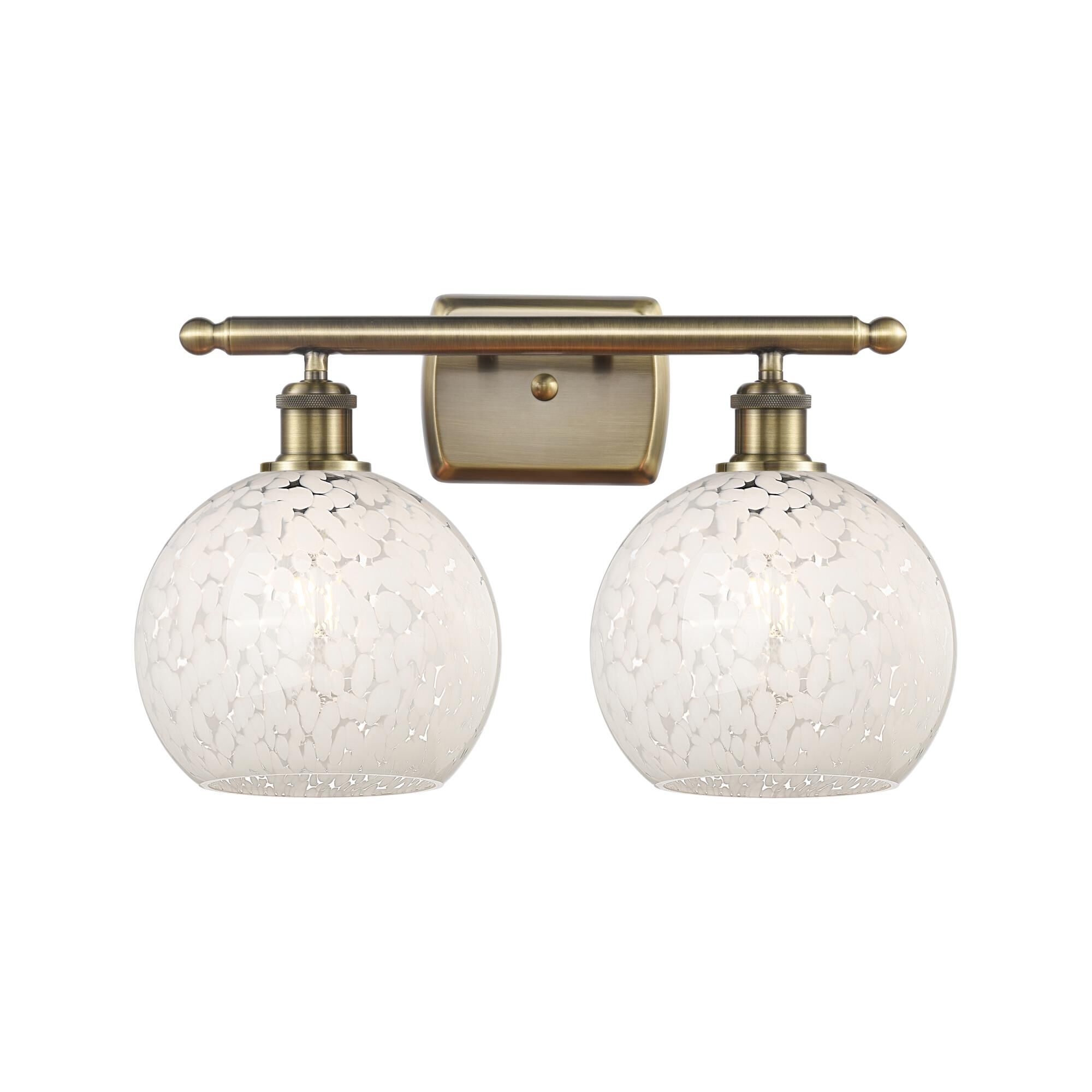Shown in Antique Brass finish and White Mouchette glass