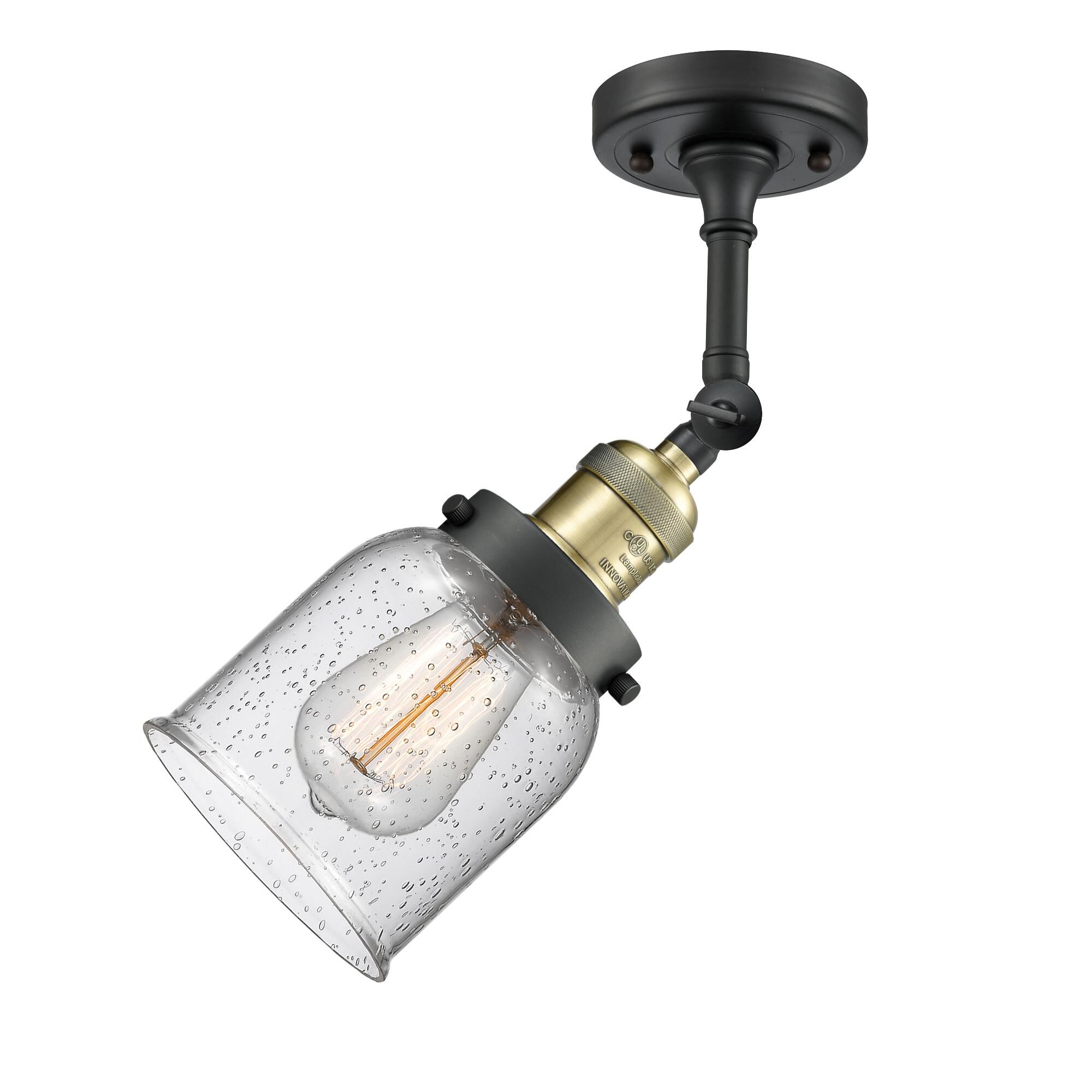 Shown in Black Antique Brass finish and Seedy glass and None accent
