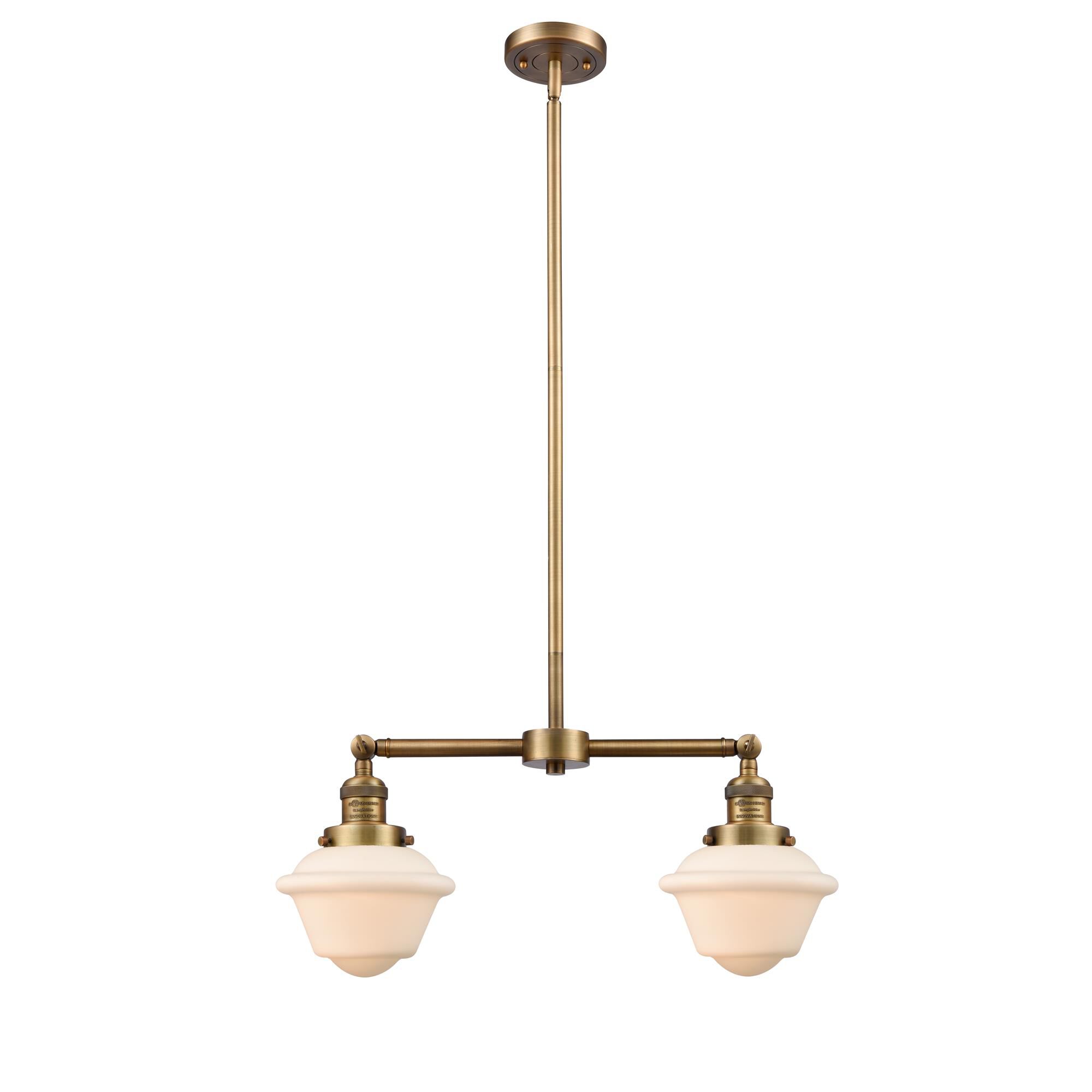 Shown in Brushed Brass finish and Matte White Cased glass