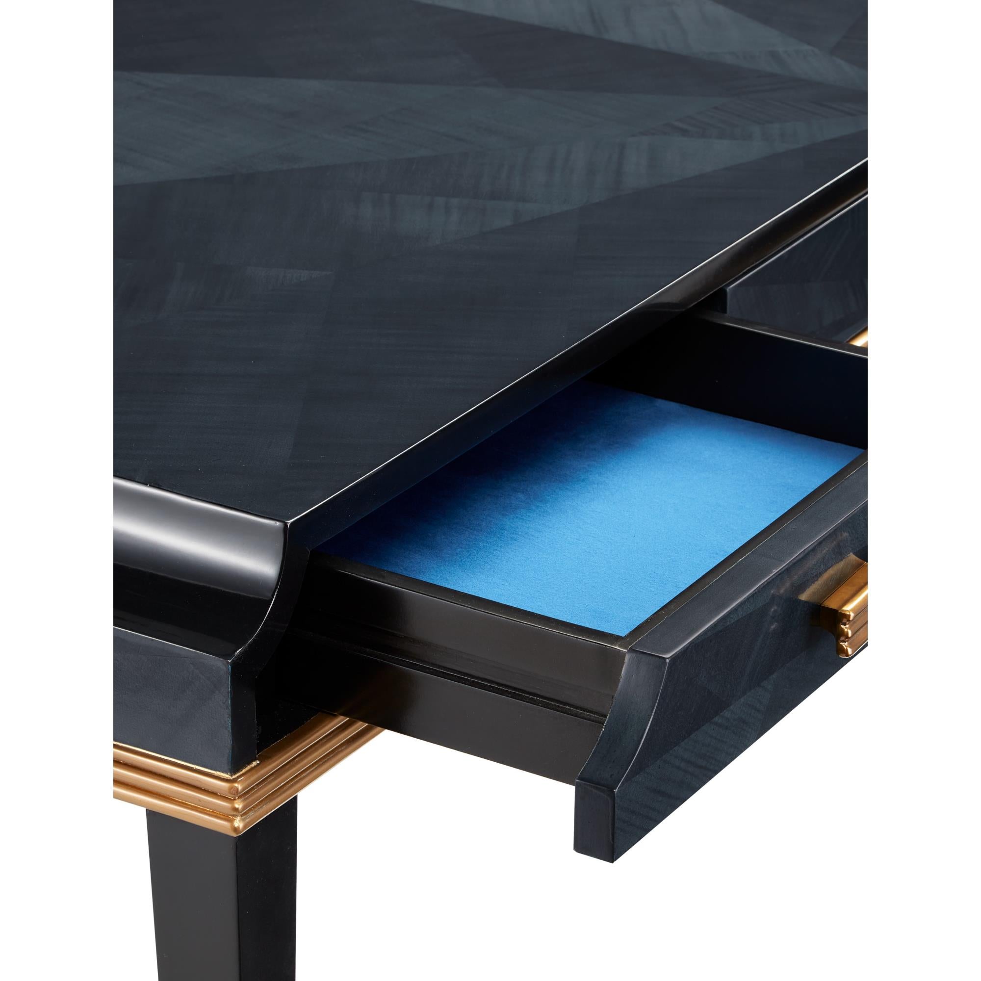 Close-up of a deep blue desk drawer being pulled open revealing a blue felt-lined interior.